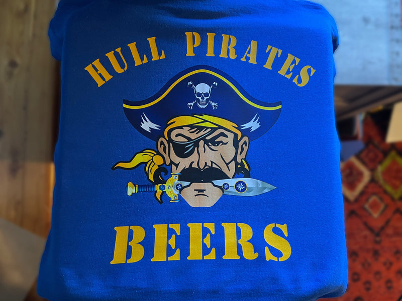 Blue t-shirt with a pirate graphic and text 'Hull Pirates Beers' on a blurred background